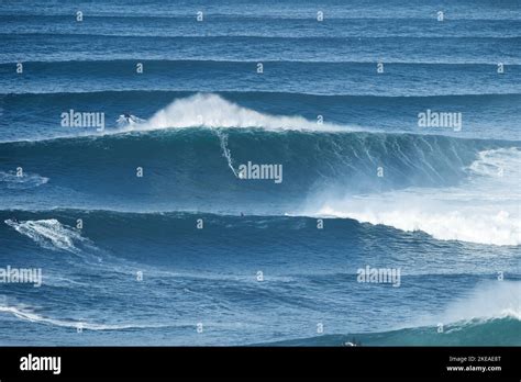 Surfer Is Riding A Giant Big Wave In Nazare Portugal Biggest Waves In