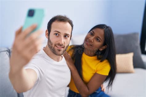Man And Woman Interracial Couple Making Selfie By Smartphone At Home Stock Image Image Of