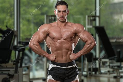 Muscular Men Flexing Muscles — Stock Photo © Ibrak 48561915