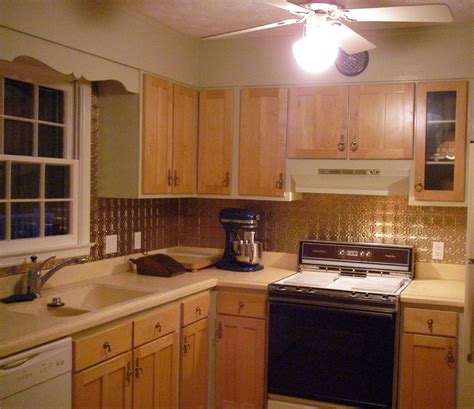 But the old door hinges weren't located at the same spot at the top and the bottom, so i decided to drill them myself. Added Brass back-splash and new cabinet doors in home ...