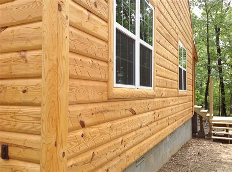 The previous owners fell behind on maintaining the exterior, and there is a significant fungus build up on it (please see pictures). LOG SIDING - RUSTIC LOGSIDING WOODSHOP