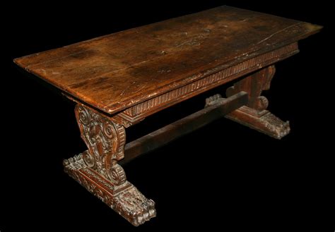 Cabinet makers were using a type of decoration called intarsia, imitating marble mosaics. Italian, Renaissance period, walnut refectory table