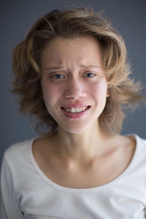 Portrait Of Young Crying Lady Frustratedly Looking In Camera Stock