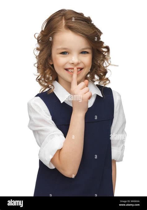 Picture Of Beautiful Pre Teen Girl Showing Hush Gesture Stock Photo Alamy