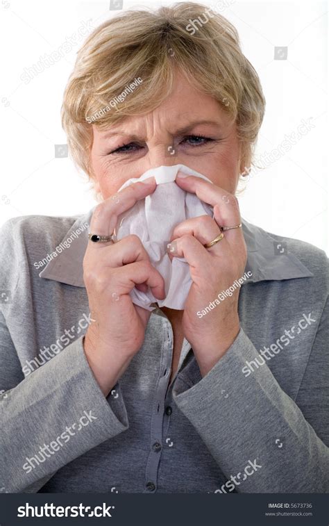 Senior Woman In 50s Sneezing Flu Or Allergy Stock Photo 5673736