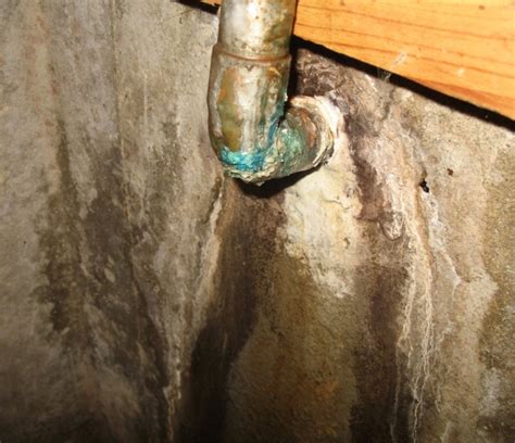 Water Leaking Out From Under Pipe In Basement Picts