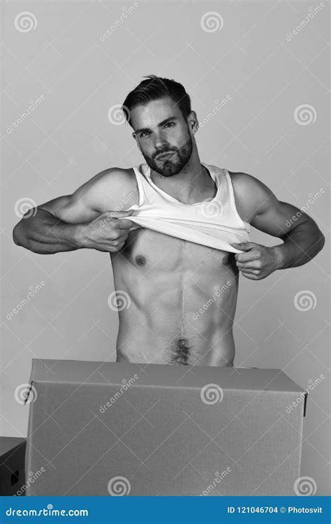 Man With Naked Torso Getting Dressed Among Cardboard Boxes Stock Photo Image Of Package Macho