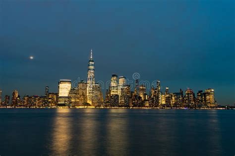 Lower Manhattan New York City Skyline At Night With The Moon Stock