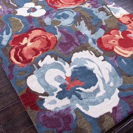 Hand-tufted wool and art silk rug with floral motif. Product