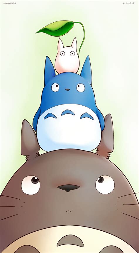 Two Cartoon Characters Are Sitting On The Back Of A Totoro And Another