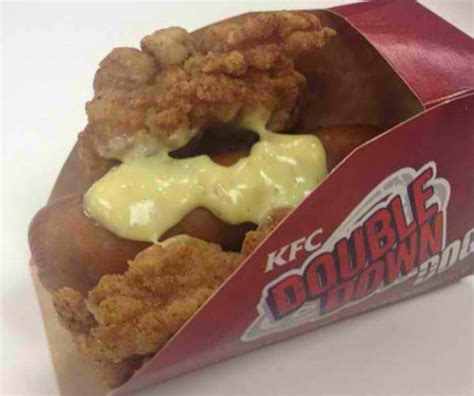 It's a hot dog drizzled with cheese sauce and swaddled by a fried chicken bun. KFC Has a Double Down Hot Dog and It's as Terrifying as It ...