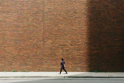 Hd Wallpaper Woman Walking Down The Street Along Red Brick Wall Girl