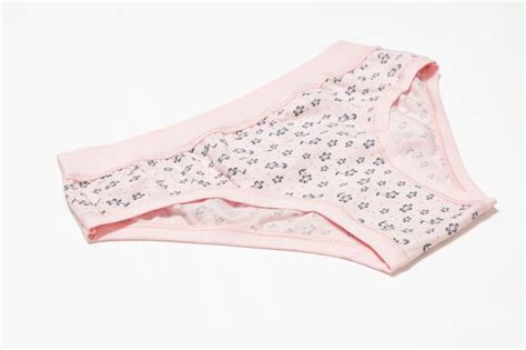 premium photo pink cotton panties on the white surface