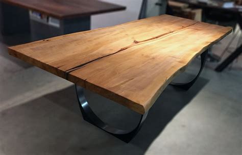 The coffee table build was. One of a kind Arbutus single slab table top. Very old tree ...