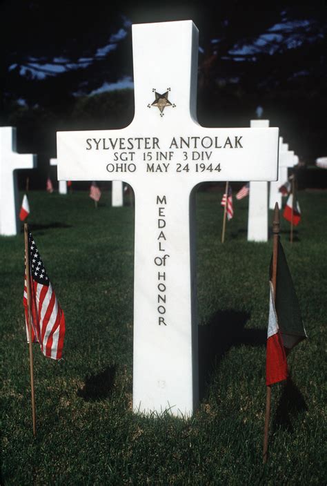 A Cross Marks The Grave Of Medal Of Honor Recipient Sergeant Sgt