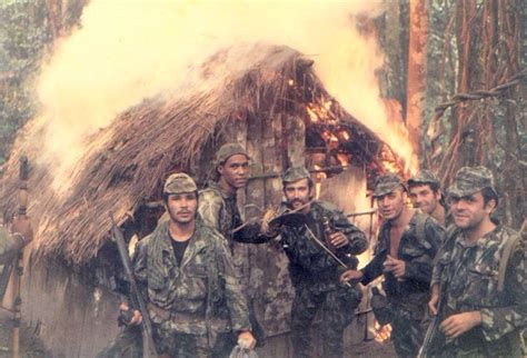Portuguese Soldiers Torching A Hut Belonging To Guerrillas During The