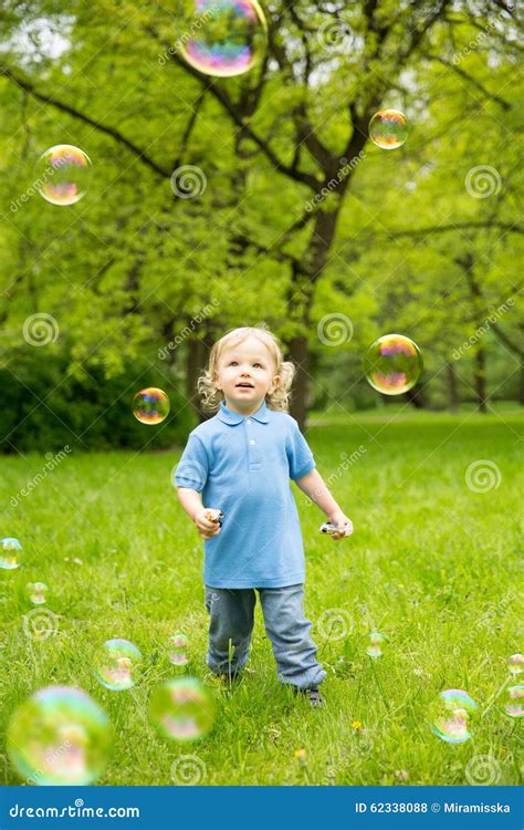 Cute Curly Baby With Soap Bubbles Children Playing Stock Photo Image