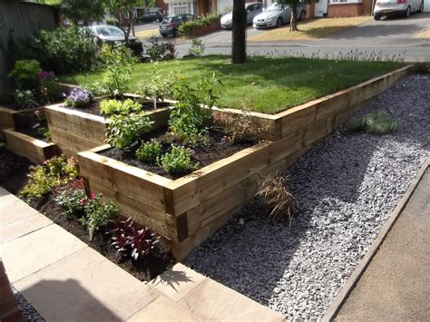 A gravel garden path lined with large rocks that. Landscaping in Wilmslow - Grounds Maintenance and ...