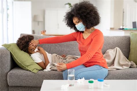 Mother Taking Care Of Her Sick Son At Home Stock Image Image Of Home