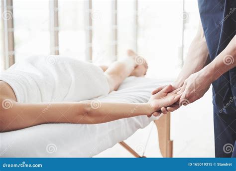 A Young Beautiful Girl Lying On A Massage Table And Receiving Relaxation Massage Stock Image