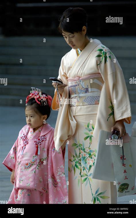 Japanese Mother And Daughter In Kimonos At The Meiji Shrine Tokyo