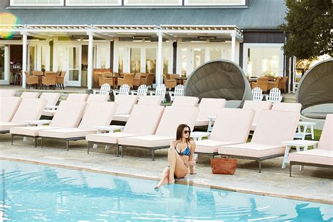 Woman Relaxing By Pool At Luxury Resort On Vacation By Stocksy Contributor Trinette Reed