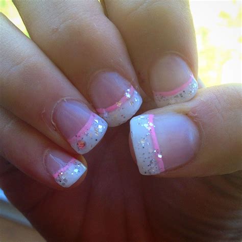 White French manicure with a twist, silver glitter, and a ... A french manicure is a chic, polished, and timeless look.