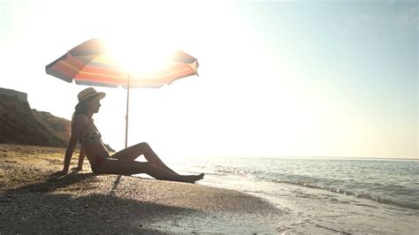 Woman Sitting Near Beach Umbrella Girl Sea And Sun Hot Summer On Exotic Island Stock Video