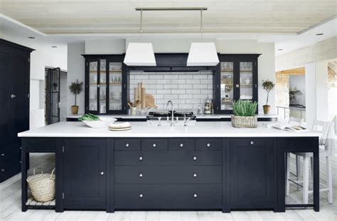 A wall of cabinetry covered. How Can Black Kitchen Cabinets Transform the Entire Look?