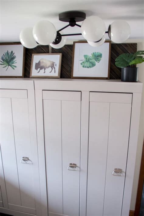 Overhead cabinets in a brilliant blue hue add a playful element that keeps the aesthetic warm and welcoming. Mudroom Cabinets - Bright Green Door