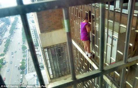 china dramatic moment firefighters rescue chinese girl 5 after she got