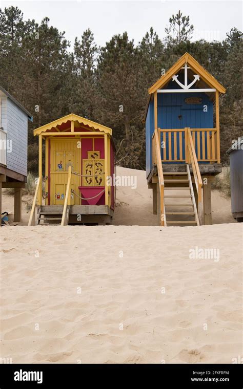 A Pair Of Colourful Beach Huts Seen On The Beach At Wells Next Sea In