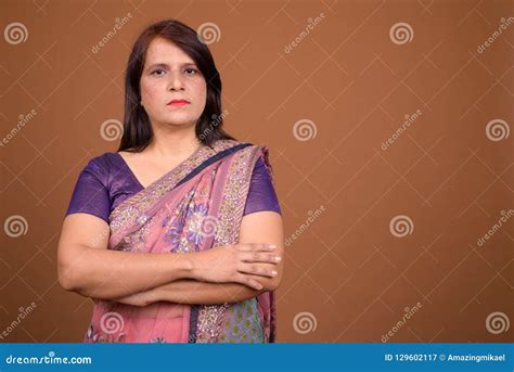 Confident Indian Woman Wearing Traditional Clothes With Arms Crossed