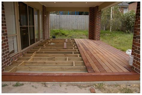 Rubberized tiles are durable and interlocking. Wood deck over concrete patio | Deck design and Ideas