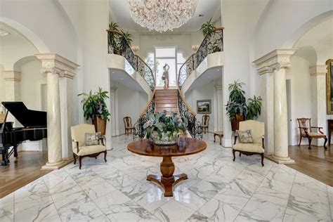 A warm and welcoming atmosphere is also attainable with the addition of a marble floor, with a pop of color on the walls that is echoed in accessories. Traditional Entryway with Columns & High ceiling | Zillow ...