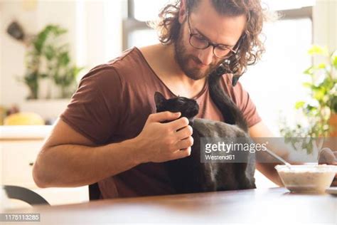 Man And Cat Photos And Premium High Res Pictures Getty Images