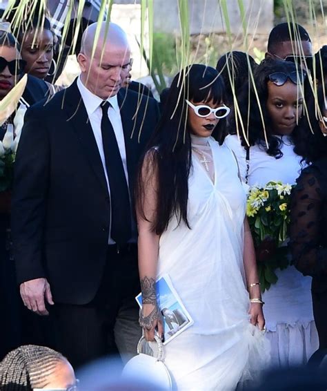rihanna wipes away tears at murdered cousin s funeral in barbados as she lays wreath on his