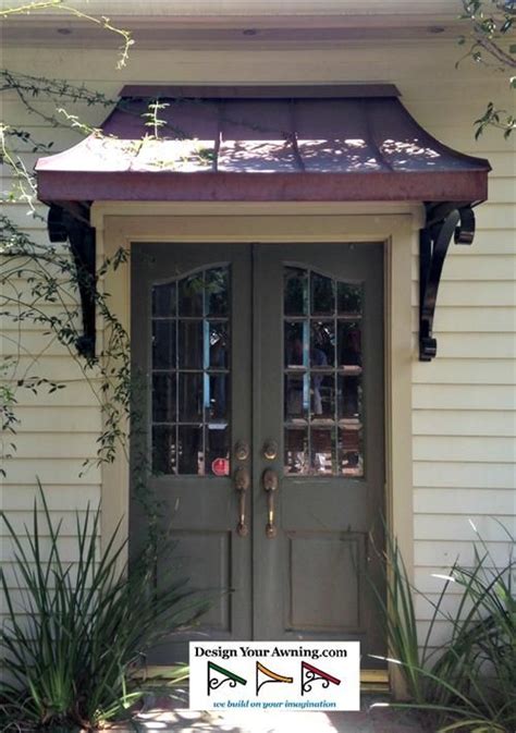 One of the simplest ways to dress up a door is by adding an awning. awnings on french doors | The metal Juliet awning over ...
