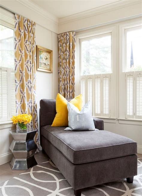 20 A Charcoal Couch And A Bold Yellow Pillow Look Very Contrasting