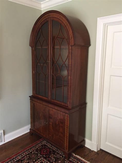 Goldenhome vanities use a floating base cabinet design (no legs) and shorter box design. Baker Historic Charleston China Cabinet For Sale at 1stdibs