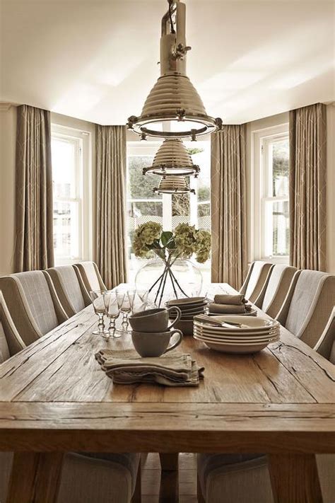The low table is by diego giacometti, and the. Taupe Dining Room with Bay Window - Cottage - Dining Room