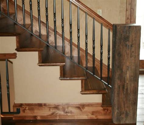 It serves as a handrail on the staircase and landing; reclaimed wood railings | Mountain Style Remodeling Inc ...