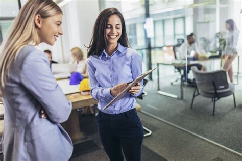 Female Executives Meeting In An Office And Smiling Stock Photo Image