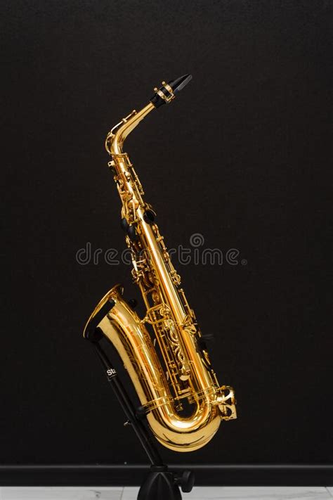 Saxophone Musician Instrument On Stand On Black Background Sax Musical