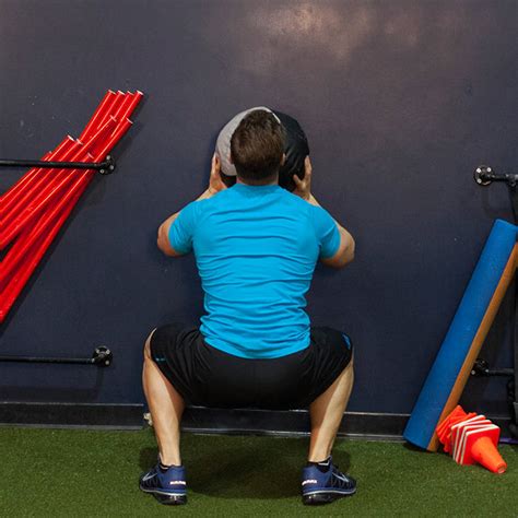 Wall Ball Squat Exercise Guide And Video