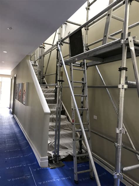 To paint a stairwell with a ladder. Scaffolding a stairwell to reach the ceiling | Mr Scaffold ...
