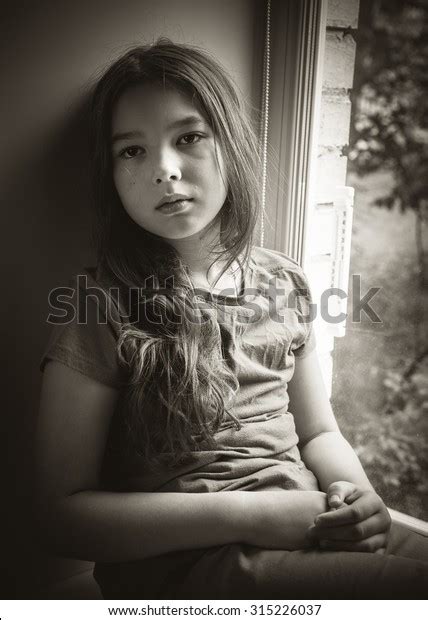 Sad Little Girl Sitting On Windowsill Stock Photo 315226037 Shutterstock