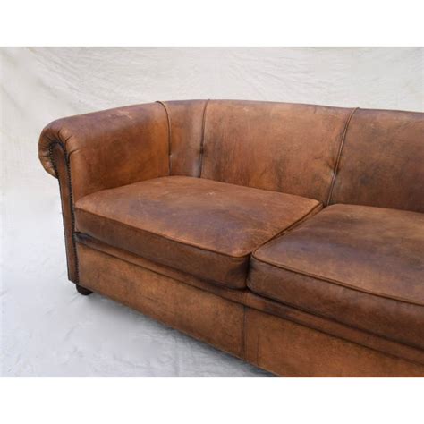 The sofa will require careful maintenance to safeguard its aesthetic features. Vintage French Distressed Leather Sofa | Chairish