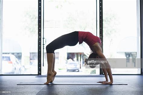 Young Woman Bending Over Backwards High Res Stock Photo Getty Images