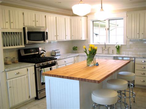 So we decided to break it up and update the look by painting the cabinets white and adding white beadboard to the eat in part of the kitchen. Beadboard Kitchen Cabinets - Cottage - kitchen - Summer ...